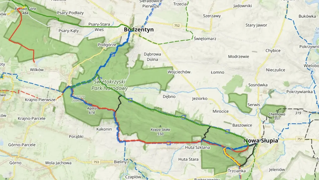 Mapa turystyczna z zaznaczonymi szlakami w Świętokrzyskim Parku Narodowym, prowadzącymi przez Bodzentyn i Nową Słupię.